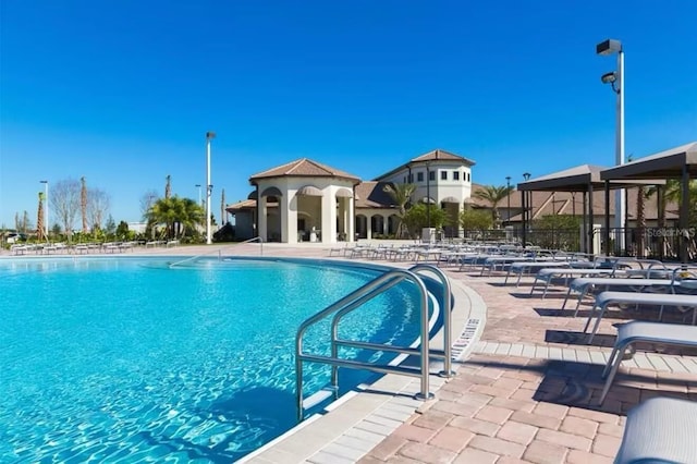 view of pool featuring a patio area