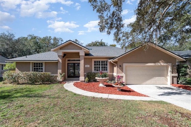 view of front facade featuring a garage and a front lawn