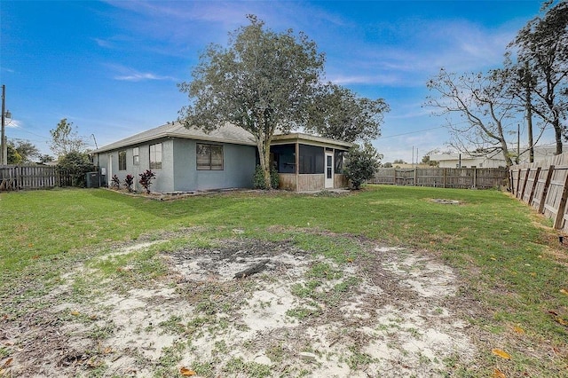 view of yard with a sunroom