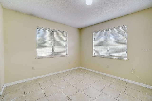 empty room with a textured ceiling