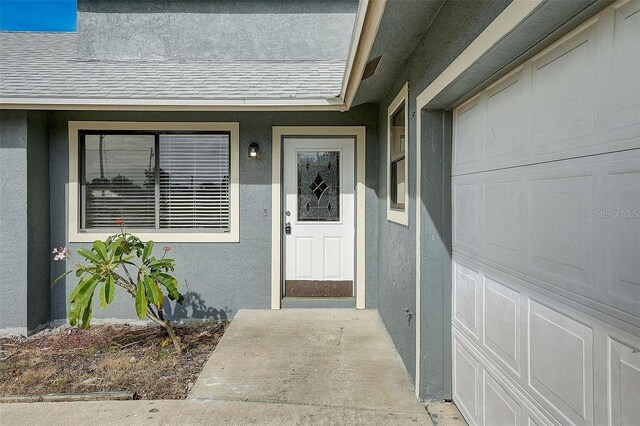 entrance to property featuring a garage