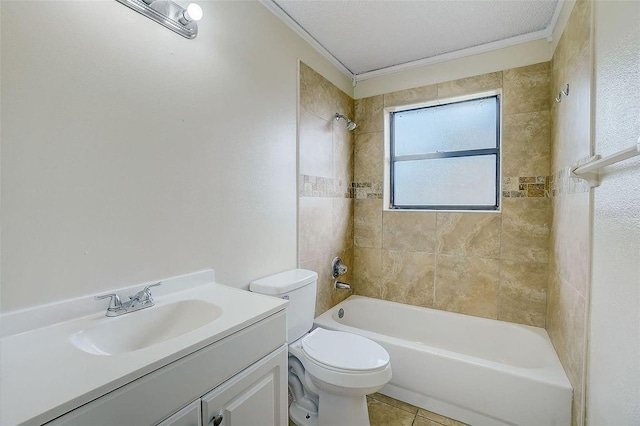 full bathroom with tile patterned floors, toilet, tiled shower / bath, a textured ceiling, and vanity