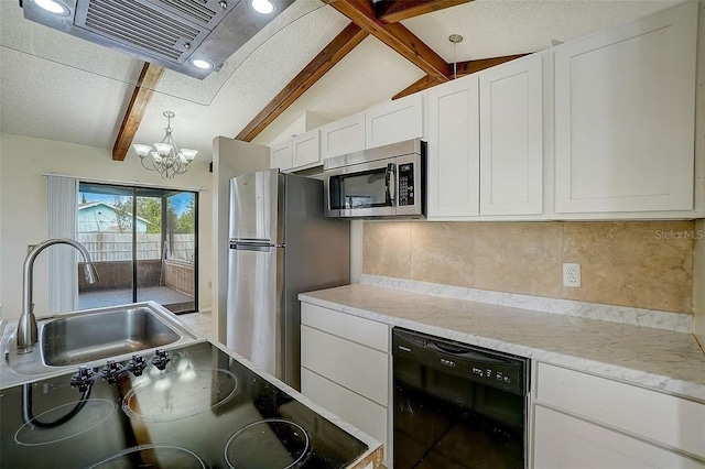 kitchen with decorative light fixtures, lofted ceiling with beams, white cabinetry, sink, and stainless steel appliances