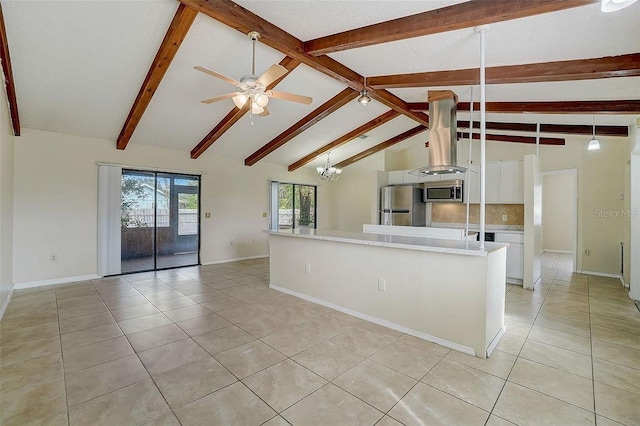 kitchen featuring stainless steel appliances, hanging light fixtures, vaulted ceiling with beams, and light tile patterned floors