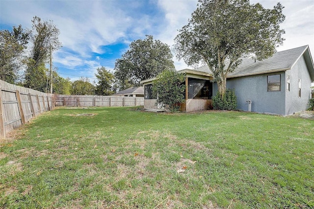view of yard with a fenced backyard