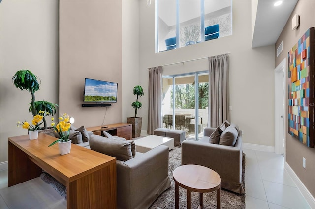 tiled living room with a high ceiling