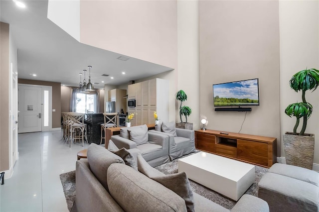 living room featuring a high ceiling