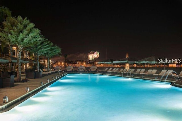 view of pool at night