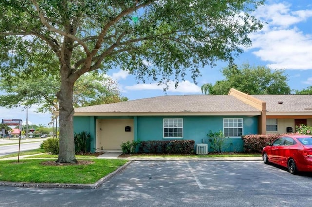 single story home featuring central AC