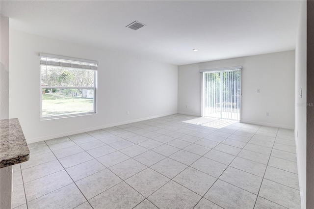 view of tiled spare room