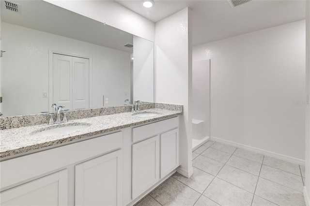 bathroom featuring tile patterned floors and vanity