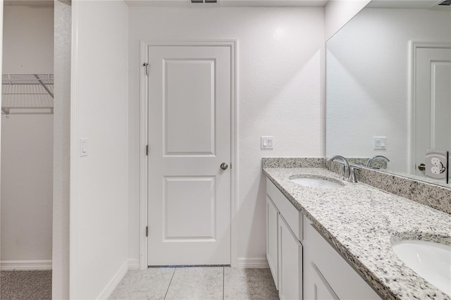 bathroom with vanity and tile patterned flooring