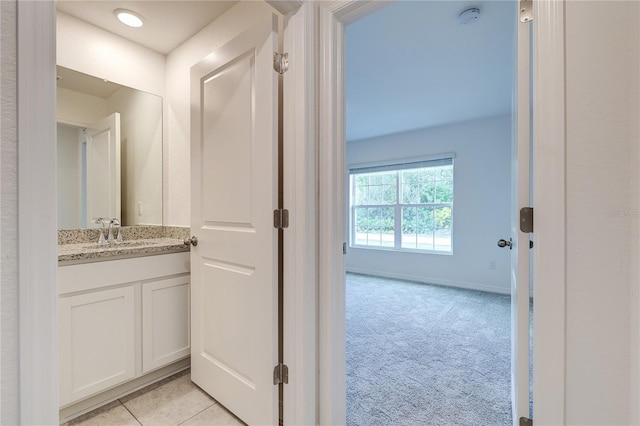 bathroom featuring vanity and tile patterned flooring