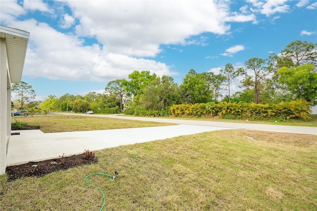 surrounding community featuring a yard