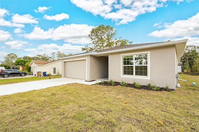 ranch-style house featuring a garage and a front lawn