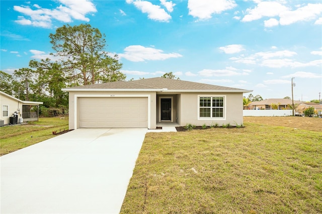 view of front of home featuring a garage and a front lawn