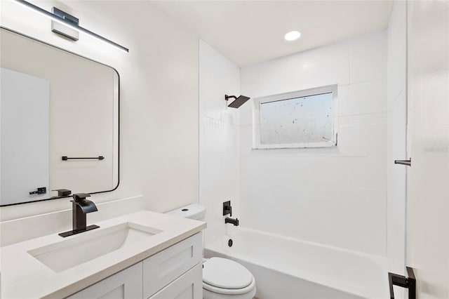 full bathroom with vanity, toilet, and tiled shower / bath combo