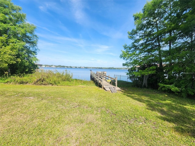 219 Nob Hill Cir, Longwood, FL 32779 - view of dock featuring a lawn and a water view