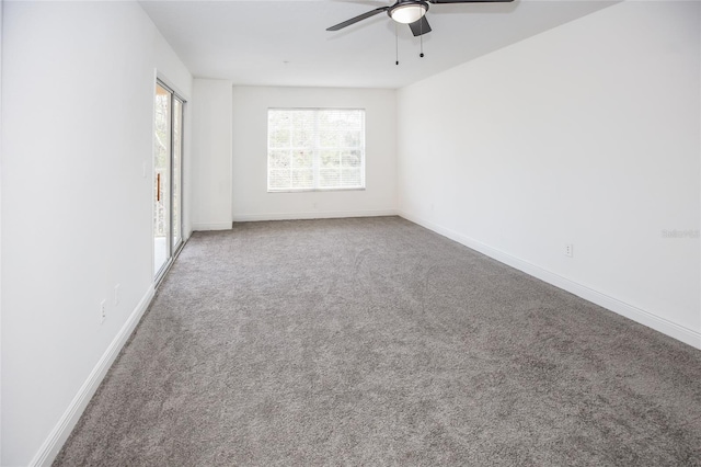 carpeted empty room with ceiling fan