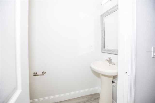 bathroom featuring hardwood / wood-style flooring and sink