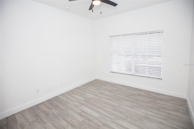 unfurnished room featuring light hardwood / wood-style flooring and ceiling fan