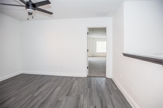 empty room featuring dark hardwood / wood-style floors and ceiling fan