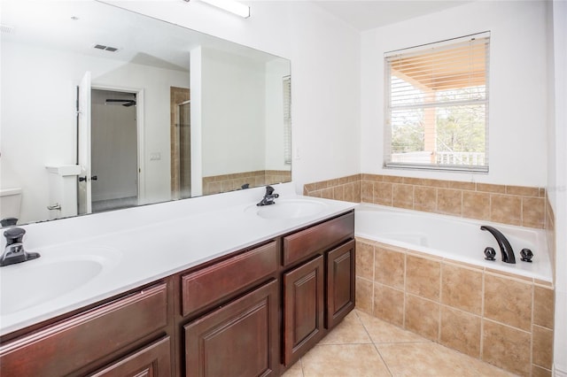 full bathroom featuring tile patterned flooring, vanity, independent shower and bath, and toilet