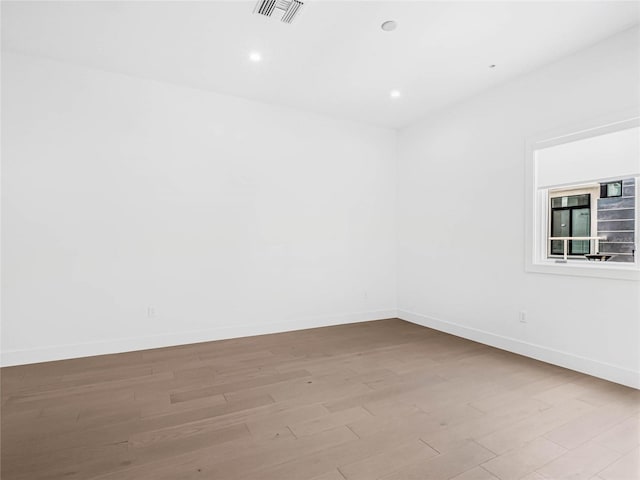 unfurnished room featuring light hardwood / wood-style floors