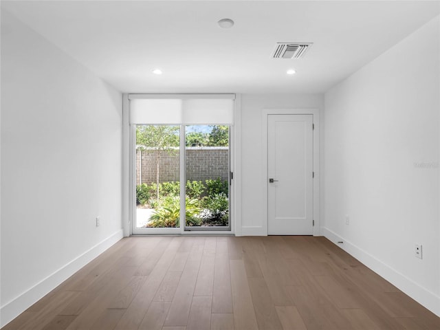 empty room featuring wood-type flooring