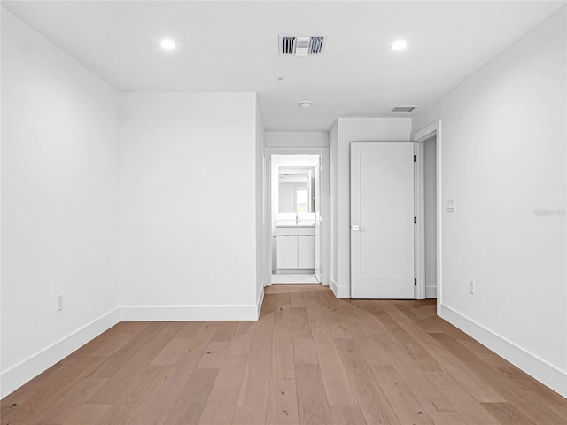 unfurnished room with light hardwood / wood-style floors