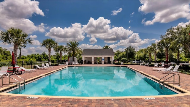 view of swimming pool with a patio