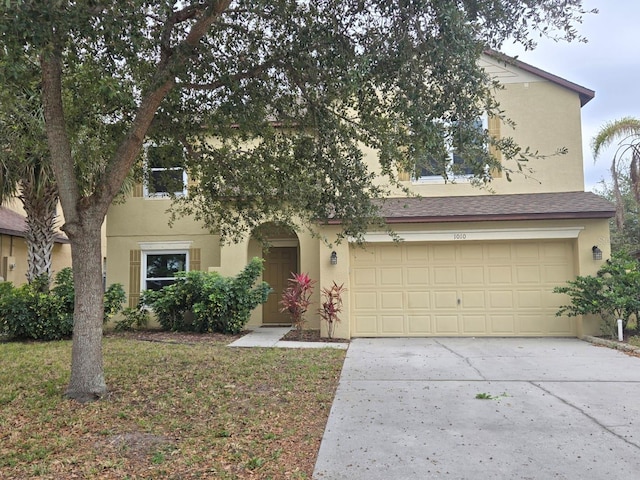 view of front of property with a garage