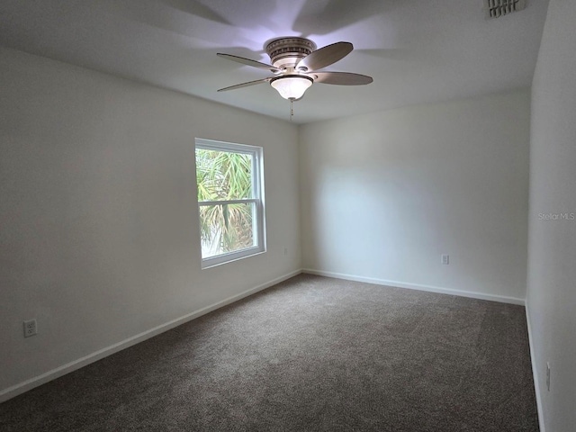 unfurnished room featuring ceiling fan and carpet flooring