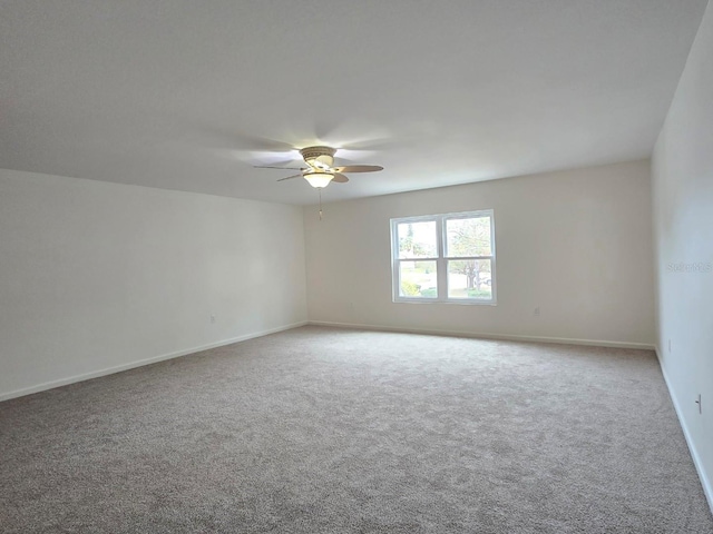 empty room featuring ceiling fan and carpet flooring