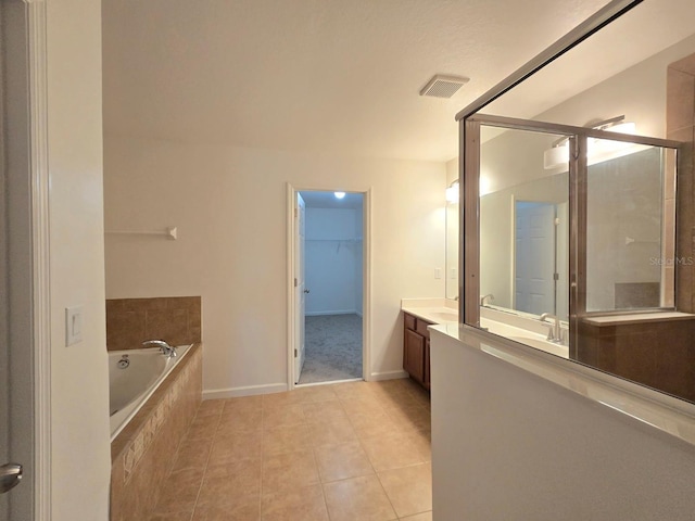 bathroom featuring vanity, tile patterned floors, and independent shower and bath