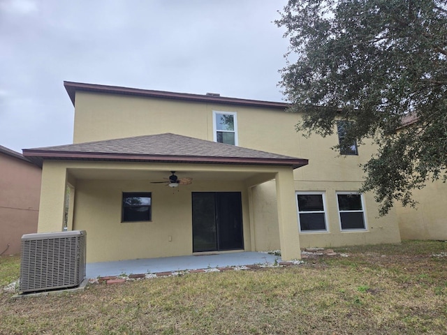 rear view of property featuring a yard, central AC, a patio, and ceiling fan