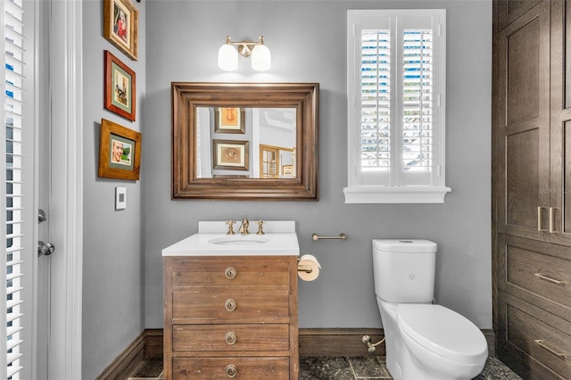 bathroom with vanity and toilet