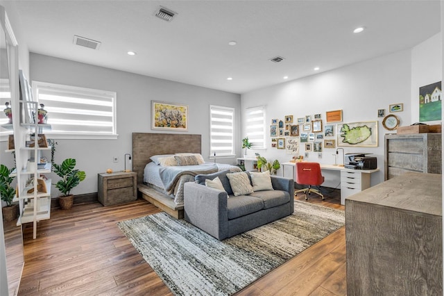 bedroom with hardwood / wood-style floors