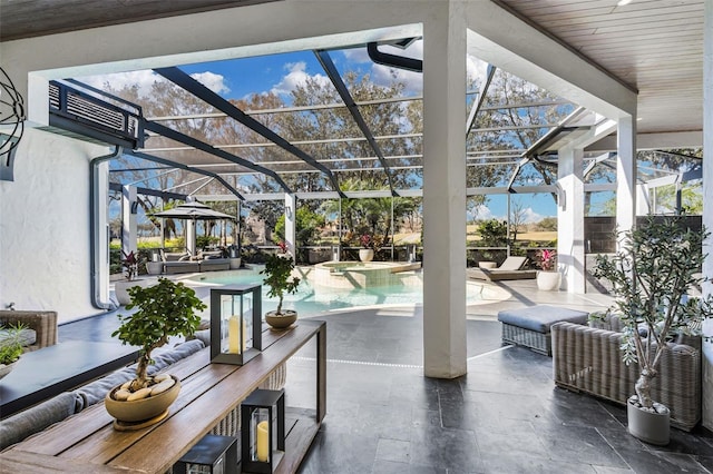 view of patio featuring a gazebo, an outdoor living space, and a lanai