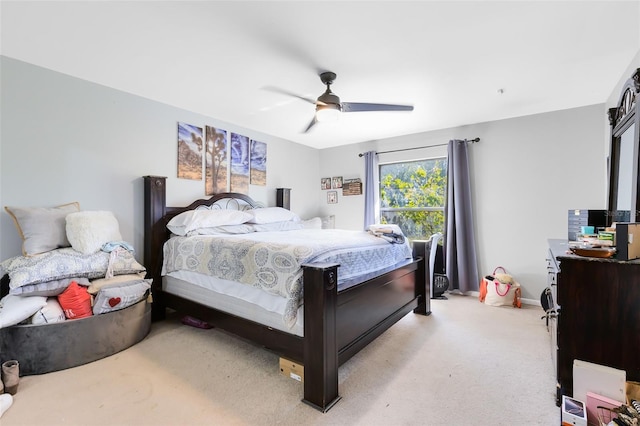 bedroom with light carpet and ceiling fan