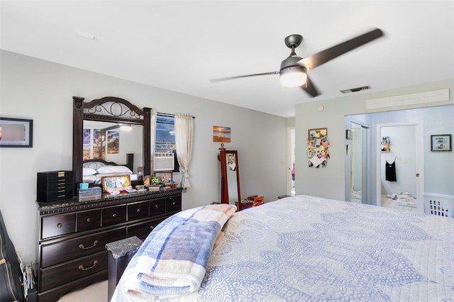 bedroom with cooling unit and ceiling fan