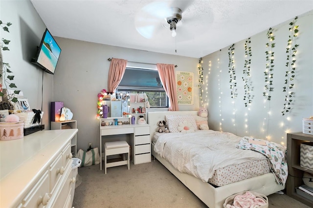 bedroom with ceiling fan and light colored carpet