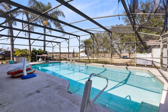 view of pool featuring a lanai and a patio