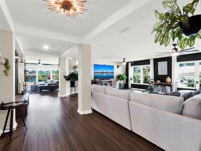 living room with ceiling fan and dark hardwood / wood-style flooring