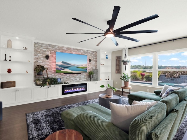 living room with wood-type flooring, ornamental molding, built in features, and ceiling fan