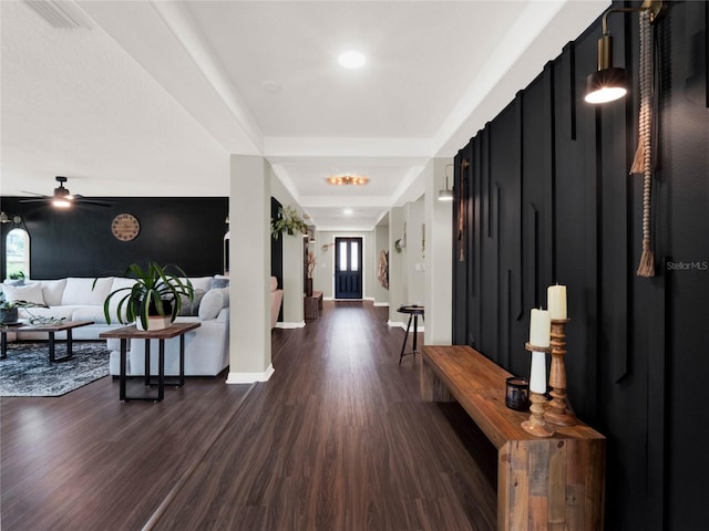 foyer entrance with ceiling fan, dark hardwood / wood-style floors, and a wealth of natural light