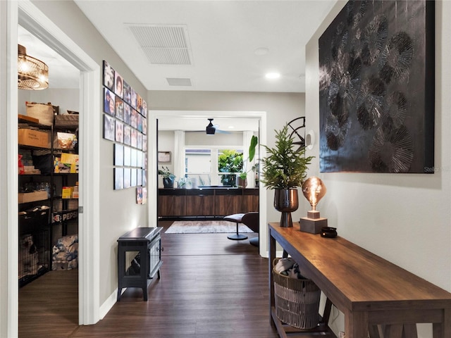 corridor featuring dark hardwood / wood-style flooring