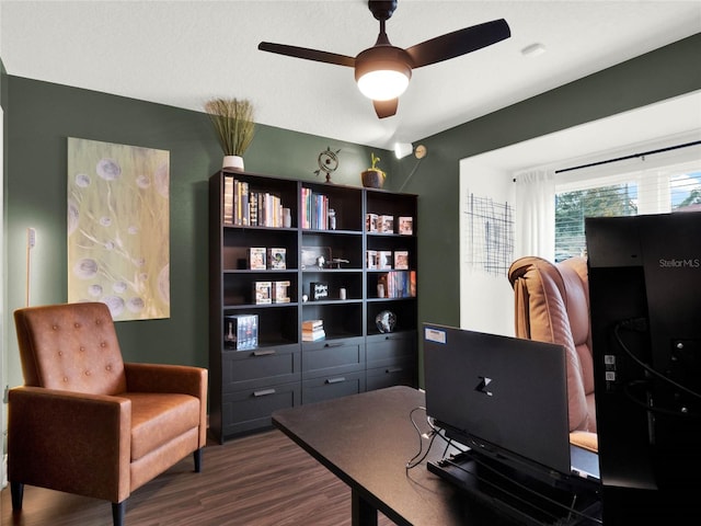 office featuring dark hardwood / wood-style floors and ceiling fan