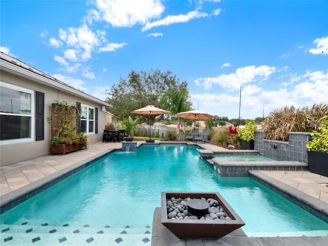 view of pool featuring an in ground hot tub and a patio