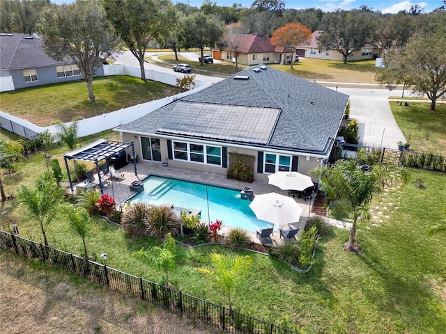 exterior space with a pergola, a patio area, and a lawn